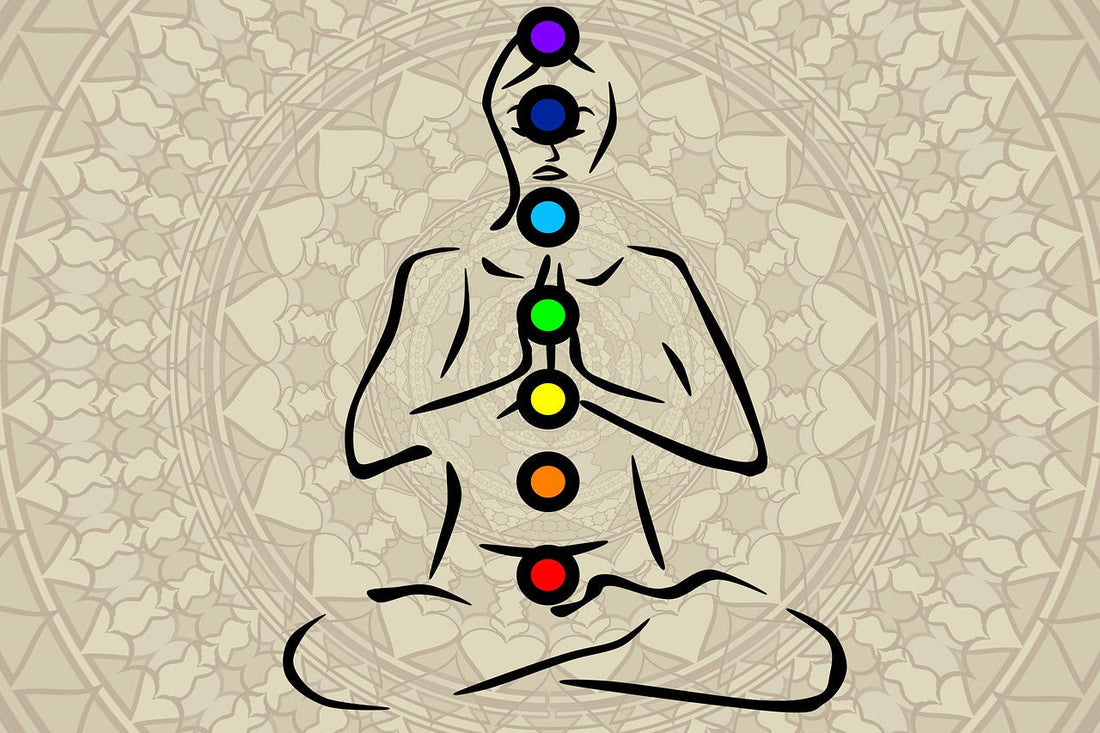 Minimalist black-line illustration of a meditating figure in a lotus pose, with the seven chakras represented by colorful energy centers along the body. A soft mandala pattern in the background enhances the spiritual and meditative feel.