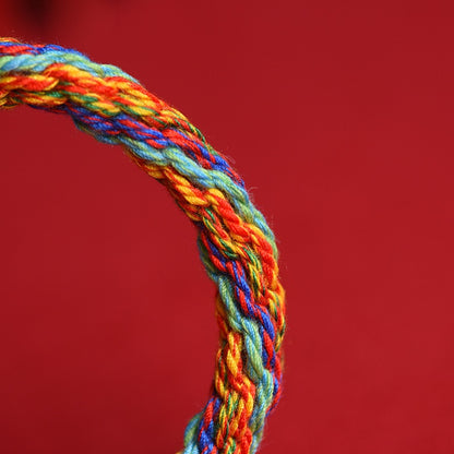 Detailed view of the five-color hand-braided eight-strand cotton cord symbolizing balance, harmony, and protection.