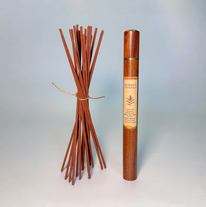 Lhasa Remedy’s Buddha’s Mandala Tibetan incense shown with a bundle of handcrafted incense sticks and the wooden storage tube.